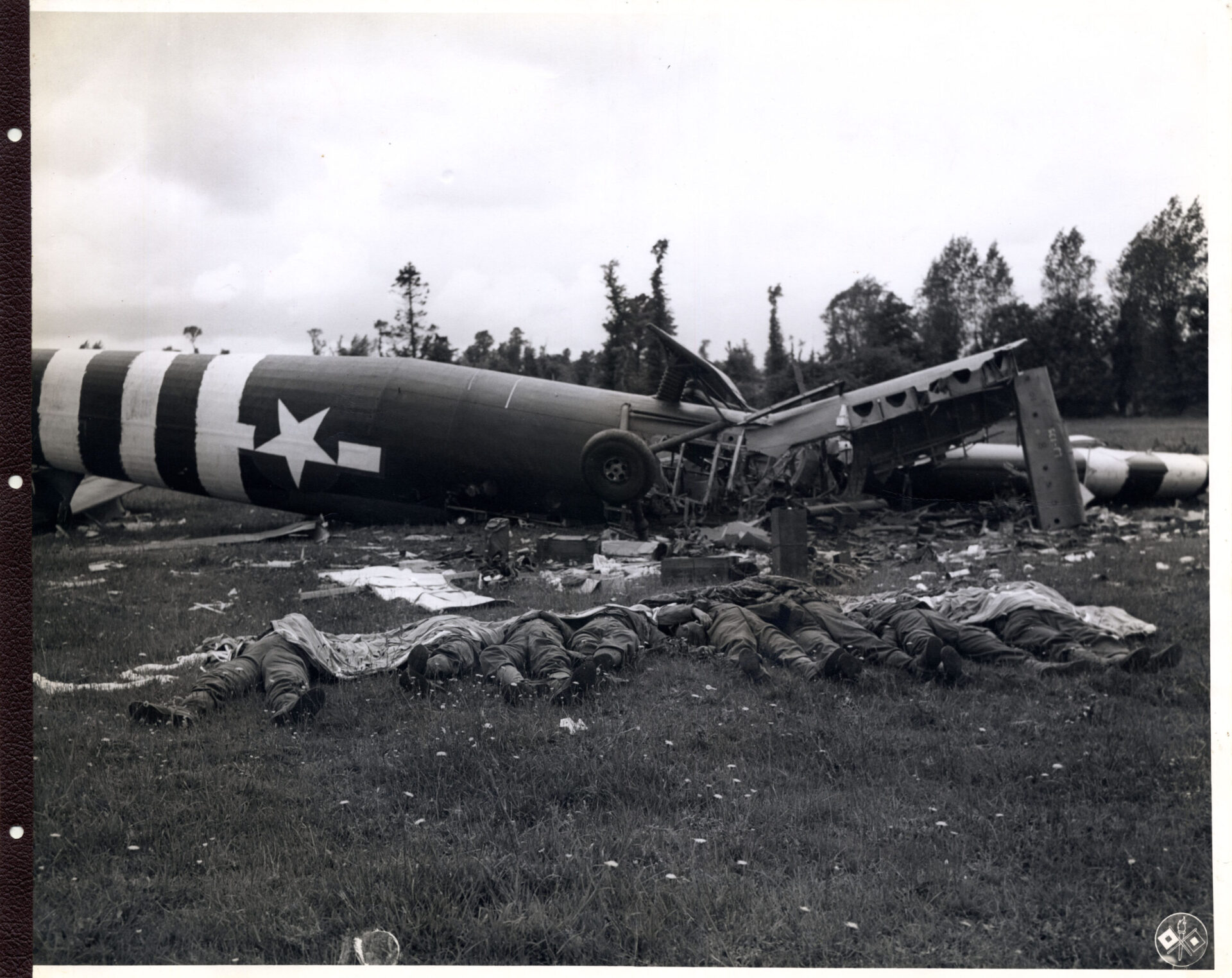 Collapsed plane Infront of dead bodies during world war 2