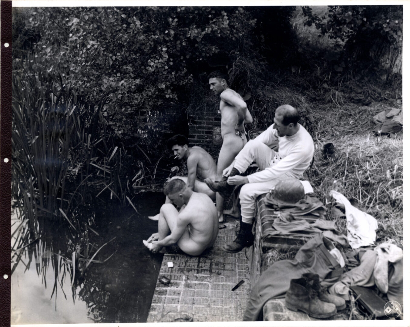 Soldiers use a rural stream to relax and clean themselves