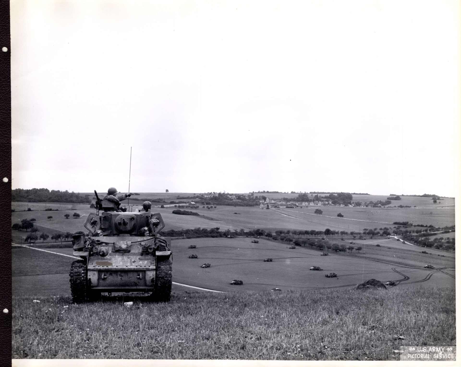 American armored vehicle takes a short break near a ridge
