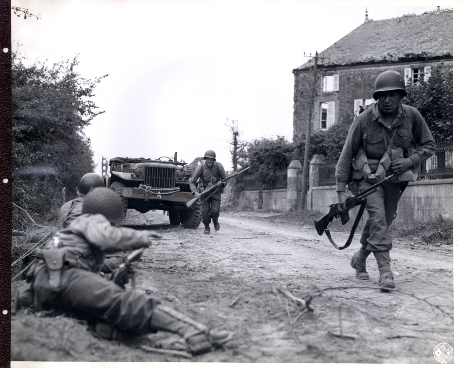 U.S. infantry troops entering a French town