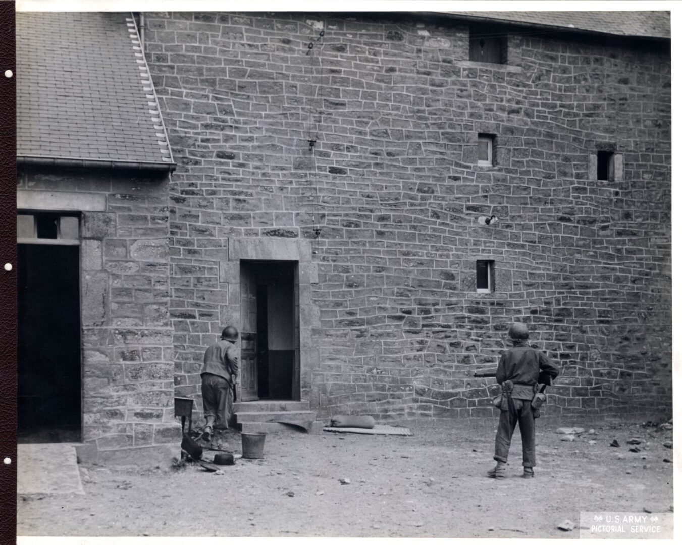 American infantrymen patrolling a town in France