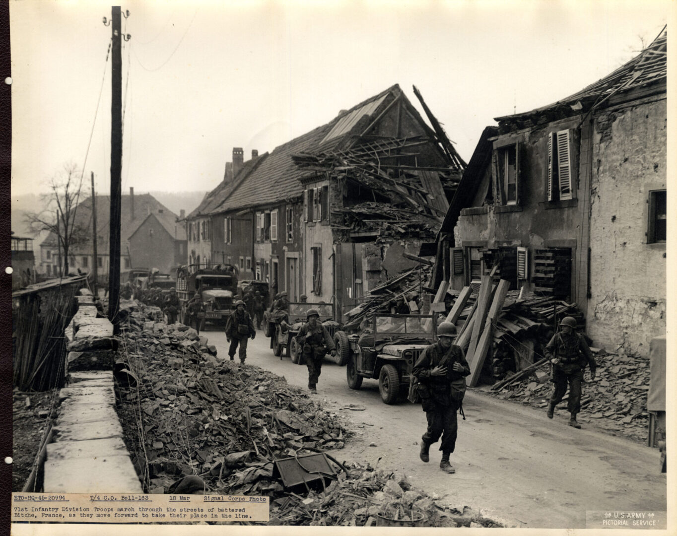 Soldiers marching through the streets of Bitche, France