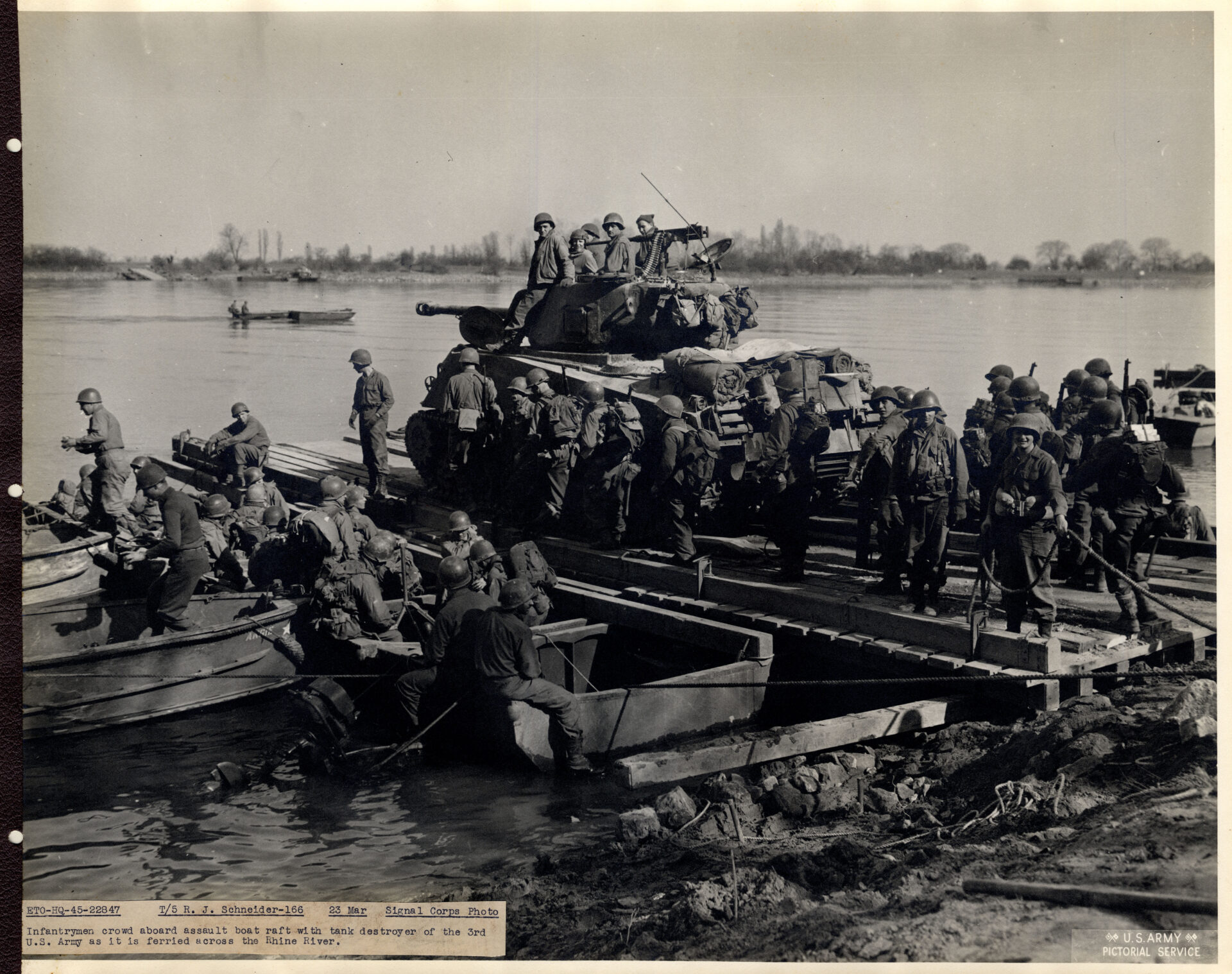 Infantrymen cross the Rhine on assault rafts