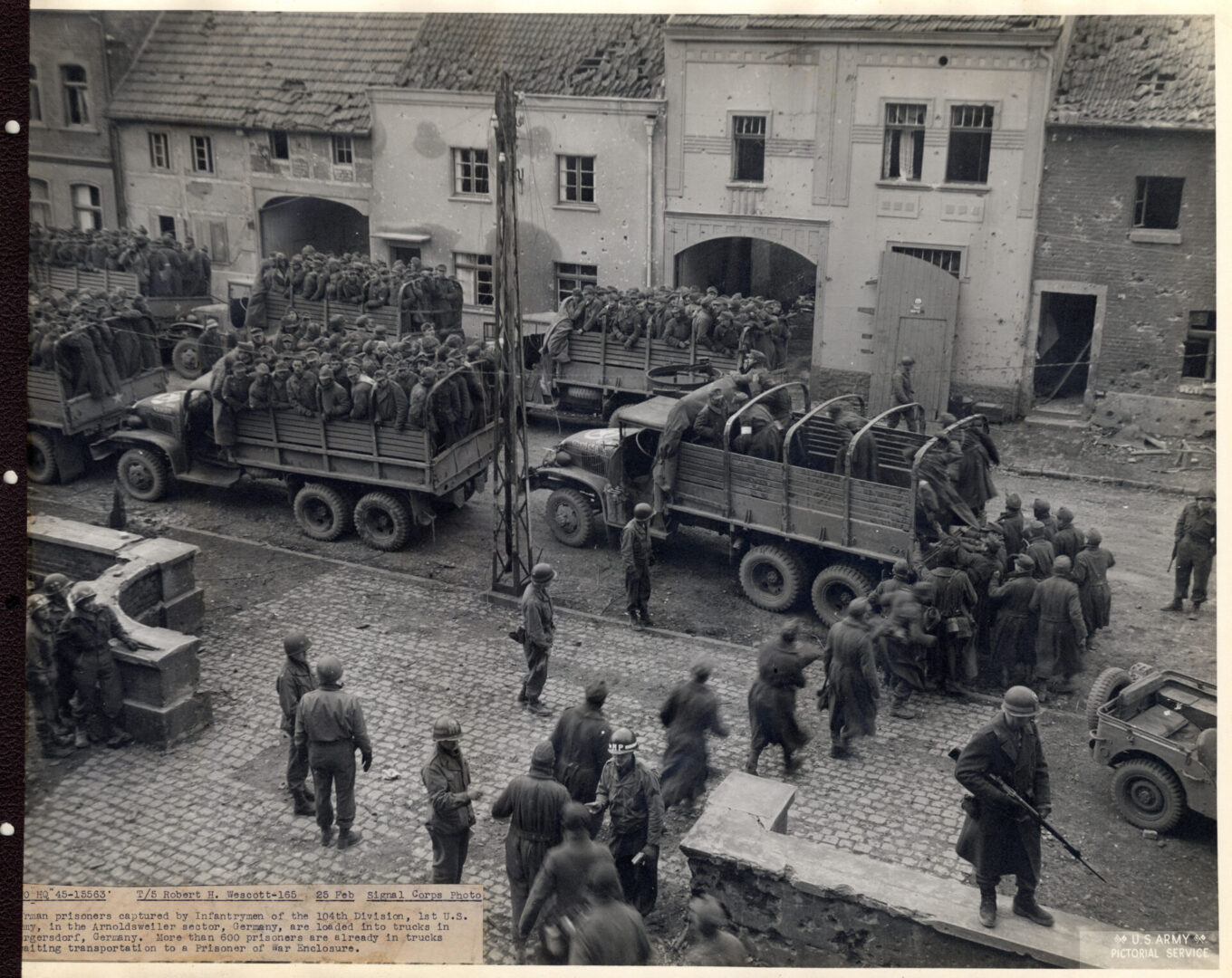 German prisoners of war being loaded into trucks