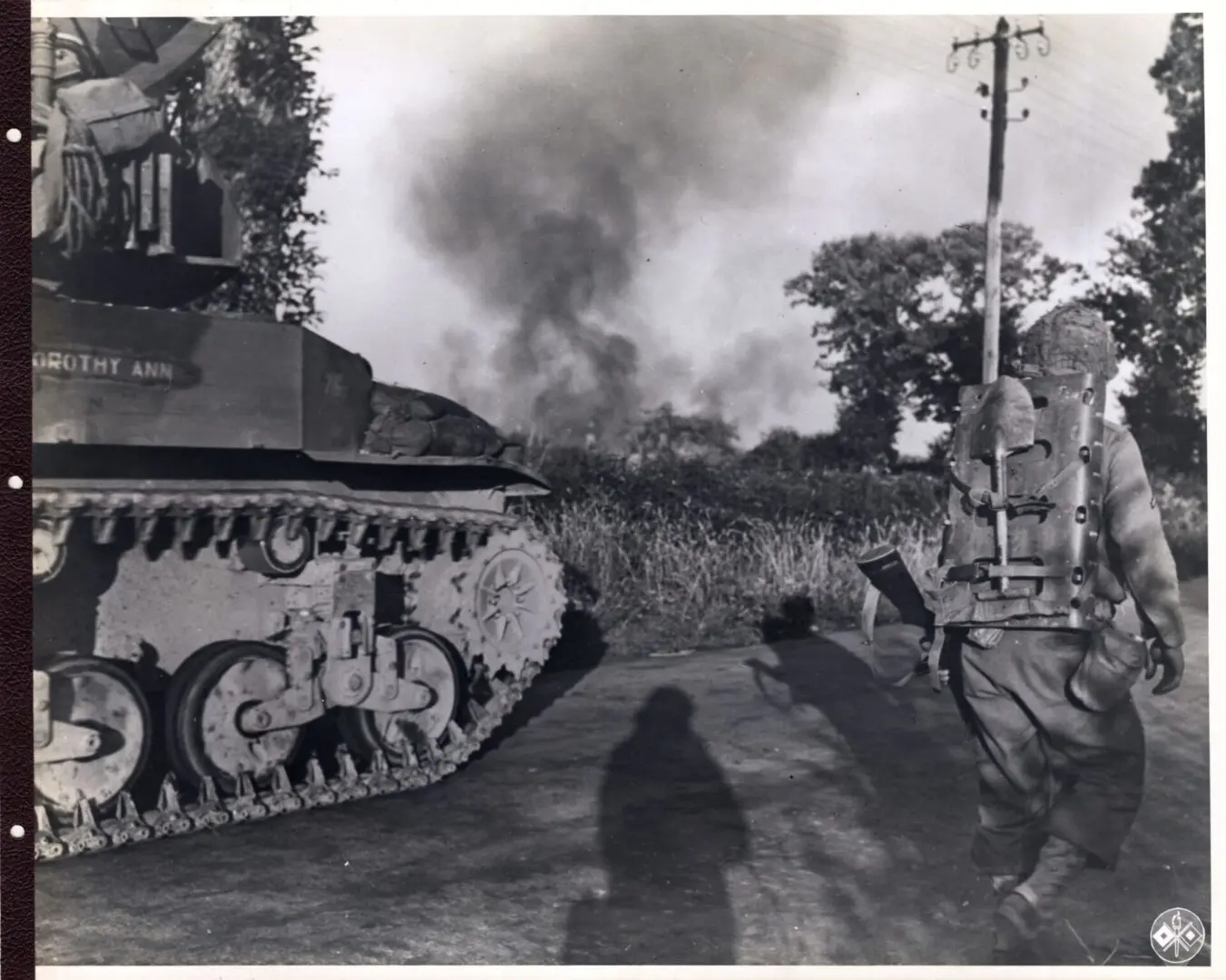 American tanks move forward chasing retreating Germans