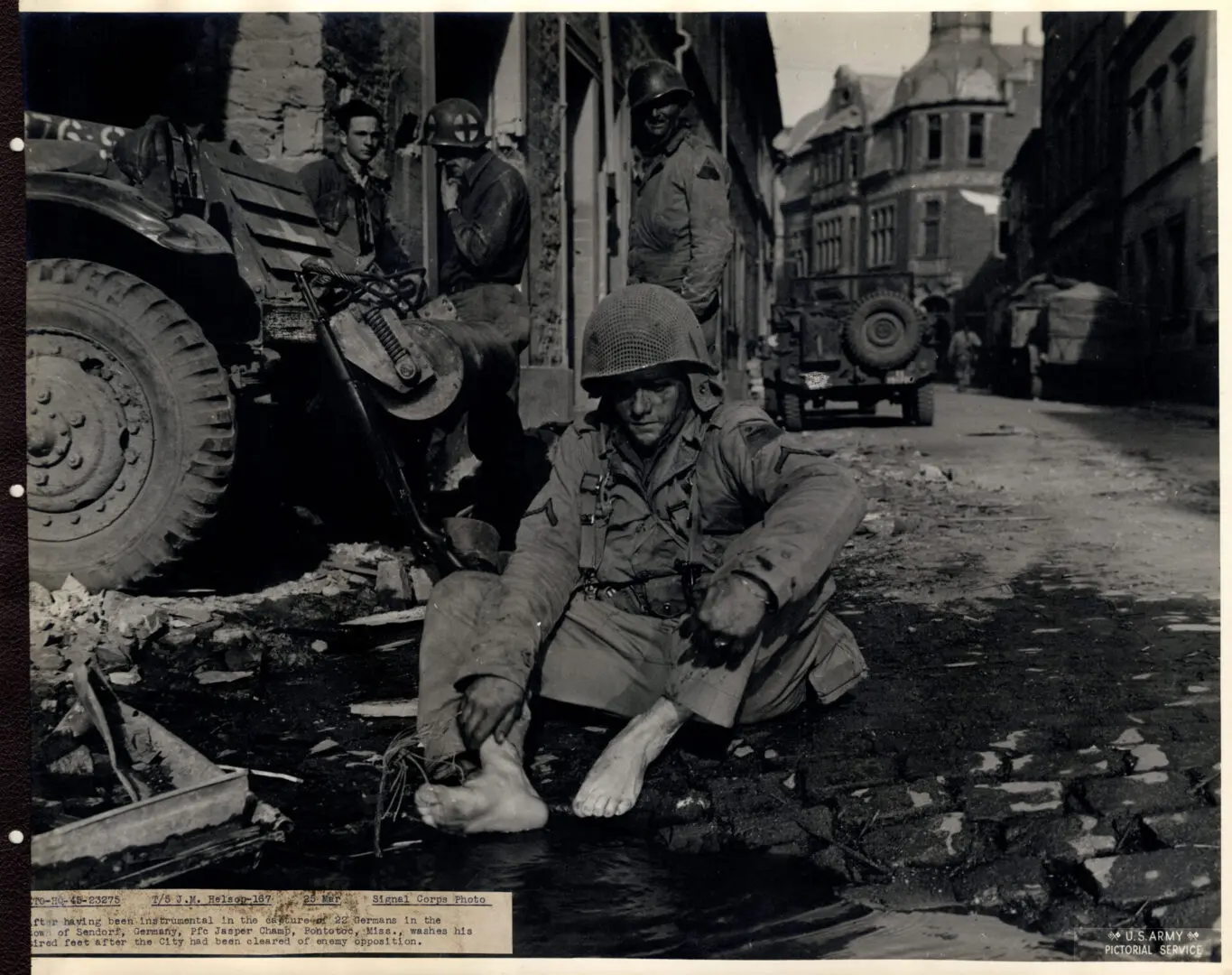 American soldier washing his tired feet after a mission