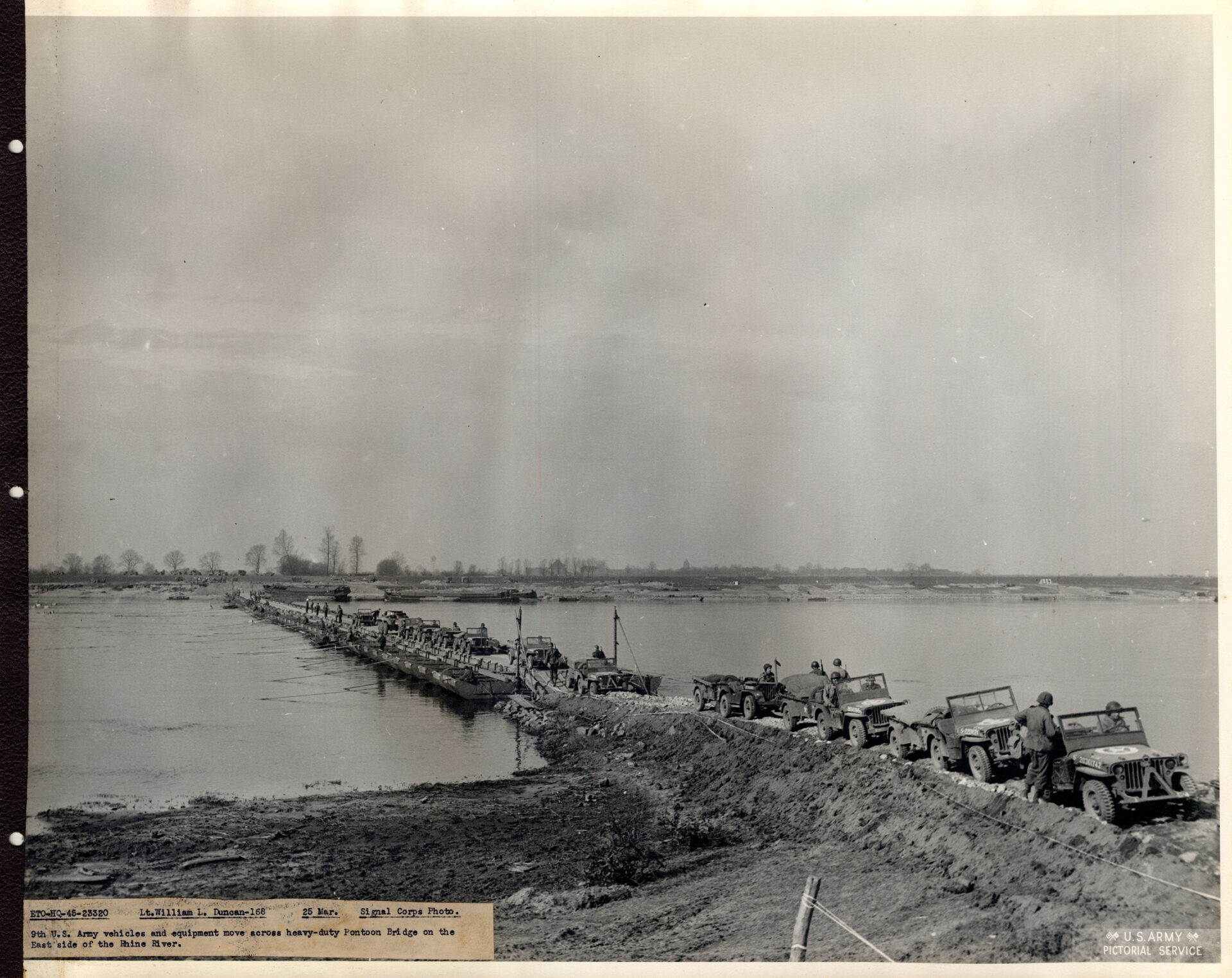 Pontoon bridge on the Rhine helps cross heavy equipment